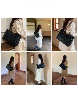 Detailed view of the large quilted tote bag with metal chain strap and square lock