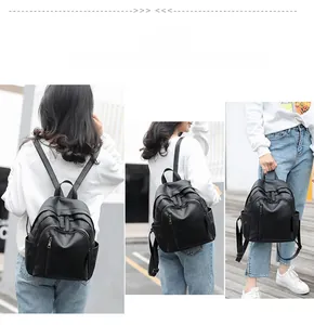 Black PU leather backpack detail showing versatile backpack, shoulder, and handbag carry modes