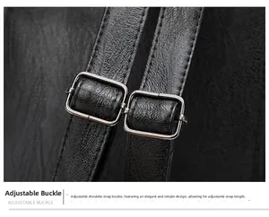 Detail of adjustable shoulder strap with silver metal buckle on black pebbled leather bag