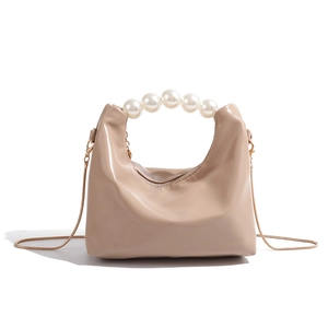 Elegant apricot mini hobo bag with pearl handle and gold snake chain strap