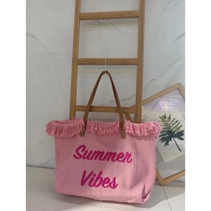 Detail of pink canvas tote with Summer Vibes embroidery and brown leather straps