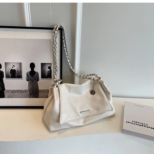 Detail of off-white pleated leather shoulder bag with silver chain strap and metal logo
