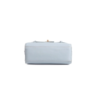 Detail view of the light blue lychee pattern leather bag bottom with neat stitching