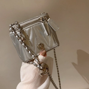 Silver quilted camellia box bag with metallic chain strap and adjustable ball slider