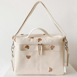 Cream canvas insulated baby stroller bag with cute bear embroidery and shoulder strap