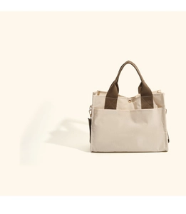 Detail of the high-density canvas tote with reinforced stitching and metal D-ring hardware
