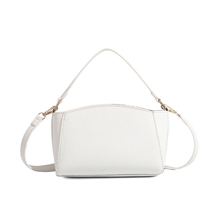 Detailed macro view of the white lychee grain leather texture and gold metal buckle