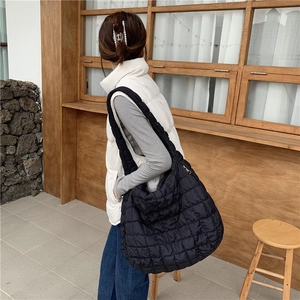 Minimalist black quilted cloud shoulder bag for women with puffy pleated texture