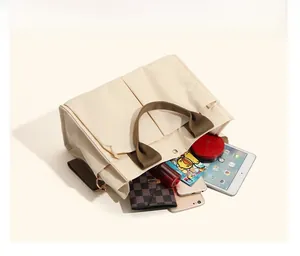 Top view of large canvas tote bag showing spacious multi-compartment interior storage