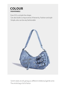 Detail of light blue denim crescent underarm bag with Y2K buckles and silver hardware