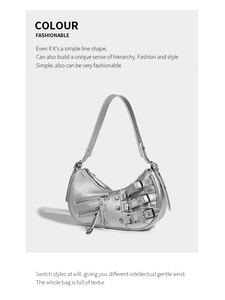 Detail view of silver Y2K hobo bag with metallic buckles and decorative zippers