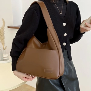 Large brown soft leather hobo tote bag with front pocket and wide shoulder strap