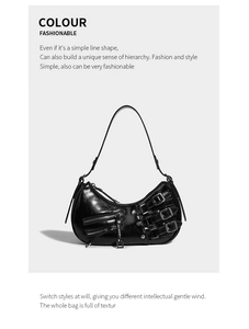 Close-up of black patent leather underarm bag with decorative metal buckles and punk style