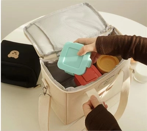 Detail showing spacious thermal interior with aluminum foil lining for lunch box storage