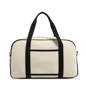 Front view of large capacity cream canvas tote bag with black contrast webbing trim detail