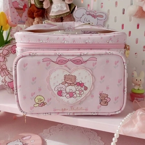Pink floral Mikko makeup bag with cute cartoon animals and heart patch handle