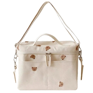 Portable beige canvas baby stroller bag with cute bear embroidery and shoulder strap