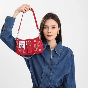Red denim star shoulder bag with silver chain strap and distressed star patchwork design