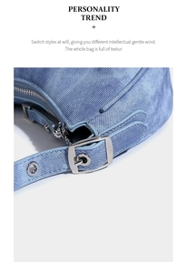 Close-up of denim blue fabric texture and silver metal buckle on adjustable shoulder bag