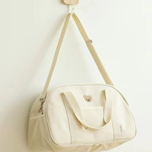 Minimalist beige canvas mom bag with bear embroidery and adjustable shoulder strap