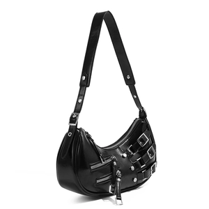 Detail of black punk style hobo bag with silver zippers, buckles and rivets