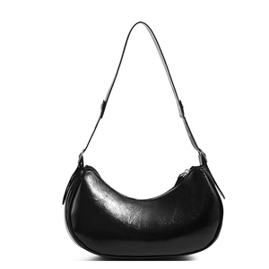 Sleek black glossy patent leather hobo shoulder bag with a polished crescent silhouette
