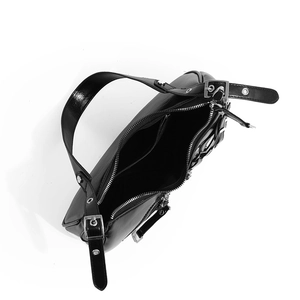Top view of black Y2K biker bag showing inner zipper pocket and silver metal buckles