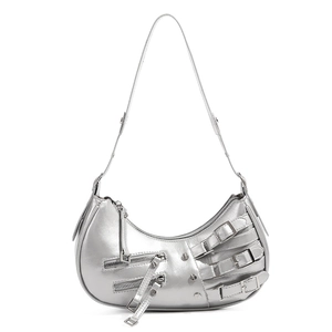 Detail of silver metallic shoulder bag with punk buckles and Y2K rivet hardware