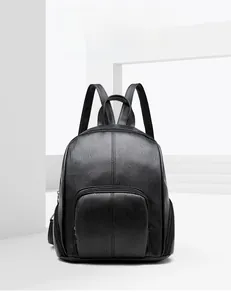 Close-up of black lychee texture leather backpack with U-shaped zipper pocket details