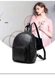 Close-up of black lychee grain soft leather backpack with luxurious zipper details