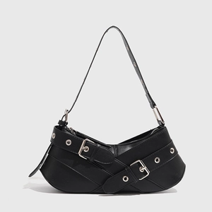 Minimalist black motorcycle shoulder bag with cross-straps and silver buckles