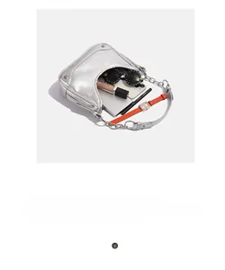 Interior view of silver metallic bag showing capacity for phone, watch and sunglasses