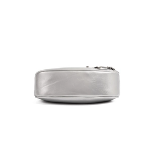 Detailed bottom view of a silver metallic leather handbag with reflective mirror finish