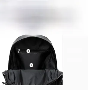 Internal view of the black backpack showing the zipper pocket and spacious main compartment