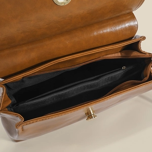 Borsa vintage marrone con tre scomparti principali e chiusura a girello dorata