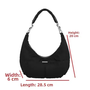 Detailed view of black crescent hobo bag with dimensions 28.5cm x 6cm x 20cm