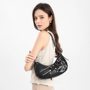 Retro black leather half-moon shoulder bag with metallic buckle details and adjustable strap