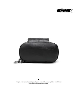 Detail view showing the oval bottom and stitching of the black pebbled leather backpack