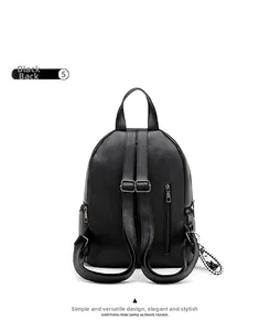 Back view of black faux leather backpack with litchi texture and checkered charm