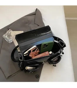 Top view of a black multi-pocket PU leather crossbody bag showing spacious interior capacity
