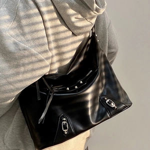 Large black leather tote bag with silver rivets and buckle in cool biker style