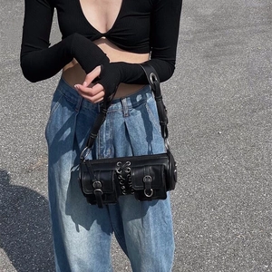 Chic black cylinder shoulder bag with double buckled pockets and silver hardware detailing