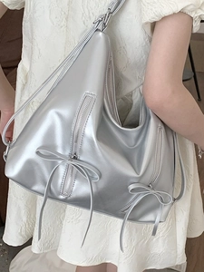 Silver bow shoulder bag for women with metallic finish and chic industrial zipper style