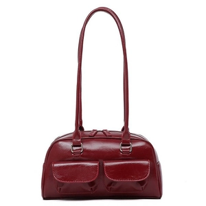 Deep red oil wax leather bowling shoulder bag with symmetrical pockets and glossy finish