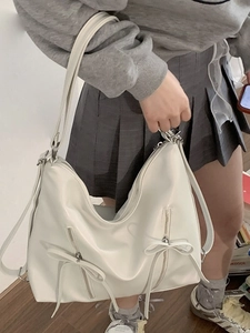 White oversized bow shoulder bag for women with dual ribbon accents and soft texture