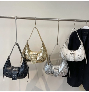 Crescent motorcycle shoulder bag, trendy rivet underarm bag, stylish PU leather handbag.