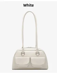 Detailed view of white oil wax leather handbag featuring double front flap pockets
