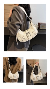 White motorcycle shoulder bag for women, trendy pleated crescent underarm handbag with chic rivets.