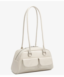 Detailed view of cream white oil wax leather bowling bag with vintage utility pockets