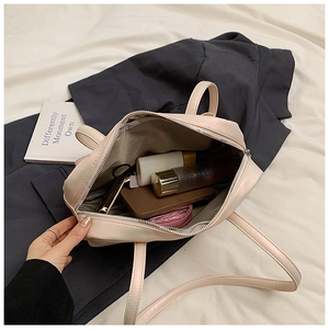 Detailed internal view of spacious pink tote bag showing storage for daily essentials